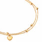 Detailansicht des Delak-Armbands aus 18k Gold mit feinem Herz und Kugelakzenten