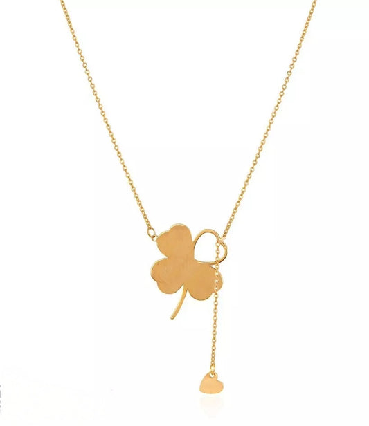 Halskette aus 18k Gelbgold mit stilisiertem Kleeblatt und frei hängendem Herzanhänger – Symbol für Glück und Liebe